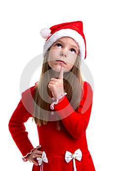 Dreamy christmas girl wearing a santa hat isolated over a white background