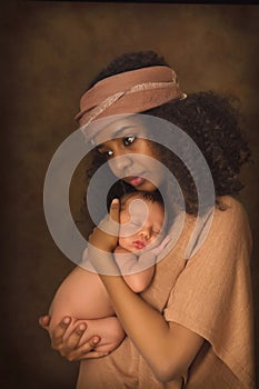 Dreamy Ethiopian mother with baby