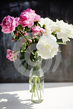 Dreamy flower bouquet of pink natural peonies flowers, spring and summer season bouquet