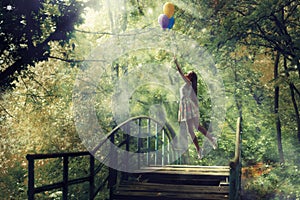 A dreamy girl in a forest with balloons.