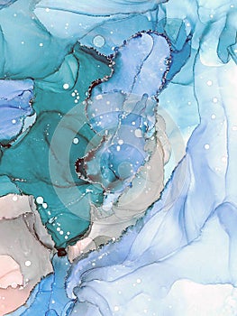 Soft abstract fluid art painting. Transparent overlayers of alcohol inks creating natural design