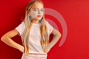 Dreamy little girl in contemlation isolated in studio