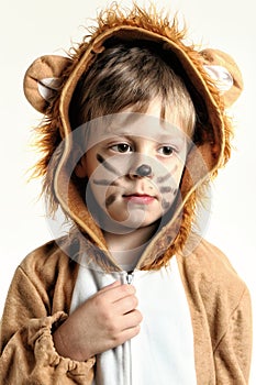 Dreamy portrait of the boy dressed for lion with whiskers