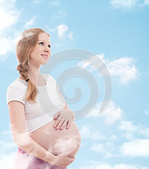 Dreamy pregnant woman enjoying life