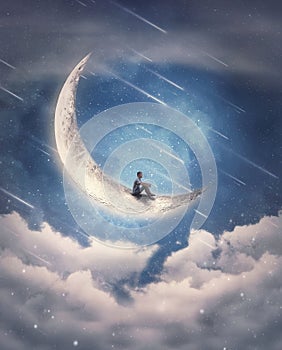 Dreamy scene with a boy seated on the crescent moon watching at the falling stars on the night sky. Magical and surreal view,