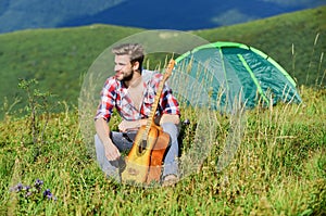 Dreamy wanderer. Pleasant time alone. Peaceful mood. Guy with guitar contemplate nature. Wanderlust concept. Inspiring