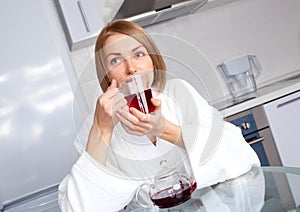 Dreamy woman drinking tea