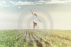 Dreamy woman runs happy in the middle of nature