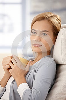 Dreamy woman with tea mug