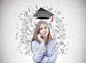 Dreamy young woman in a blue shirt, education