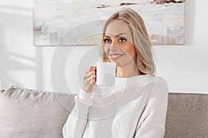 dreamy young woman in white sweater