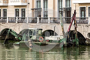 The dredger makes cleaning of the river bed in the place of formation of a pond. Russia exhibition center. Moscow. Russian Federat