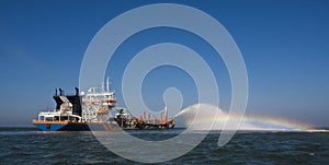 Dredger at sea photo