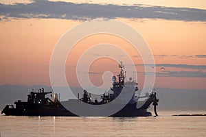 A dredger supplying sand to a beach