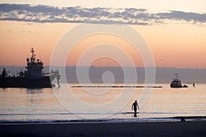 A dredger supplying sand to a beach