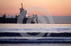 A dredger supplying sand to a beach