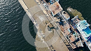 Dredging boats are excavating sand from the water