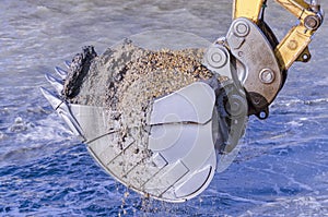 Dredging with an excavator photo