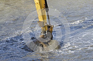Dredging harbor with excavator