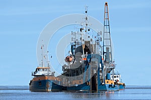 Dredging ship at work photo