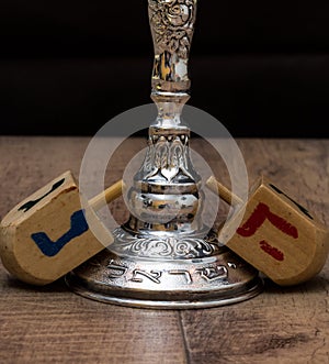 Dreidels and a menorah. Hanukkah. Text-Israel