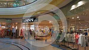 Dresden, Germany - April 18, 2024: View on store front with logo lettering of sinn fashion in shopping mall