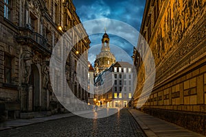 Dresden, Germany. Evening view from the street Augustusstrabe to the Dresden Frauenkirche and old porcelain artwork Procession of