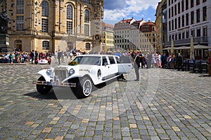 Wedding with long white limousine