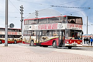 Sightseeing tour red bus Stadtrundfahrt on the Dresden street