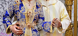 Dress the bride and groom in the wedding. Caftan Moroccan and Jellaba photo