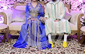 Dress the bride and groom in the wedding. Caftan Moroccan and Jellaba photo