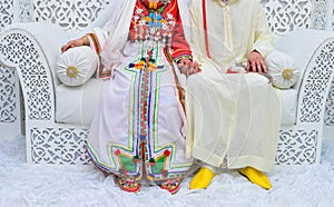 Dress the bride and groom in the wedding. Caftan Moroccan and Jellaba photo