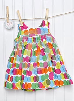 Dress on a Clothesline with Handwritten Sale Sign