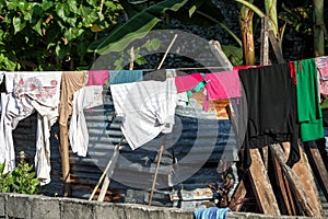 Dress drying outside poor hovel, shanty, shack