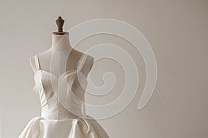 dress form with halffinished satin wedding dress