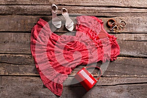 Dress and red cylinder purse.