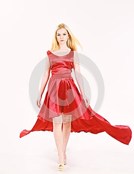 Dress rent service, fashion industry. Dress rent concept. Woman wears elegant evening red dress, white background. Lady
