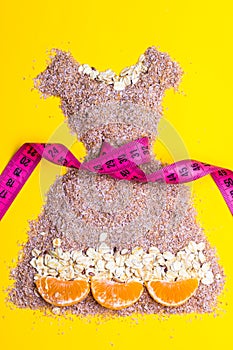 Dress shape made from bran with measure tape