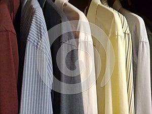 Dress shirts in the male closet photo