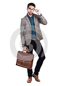 Dress for the success you want. Studio shot of a handsome young man posing against a white background.