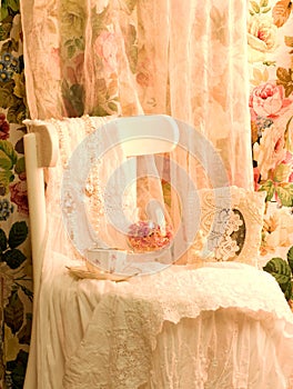 Dress, teacup and frame on white chair