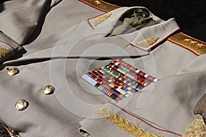 Dress uniform of a Soviet officer general. Light gray coat with piping on the collar and cuffs, gold pagons. Order bar on the coat