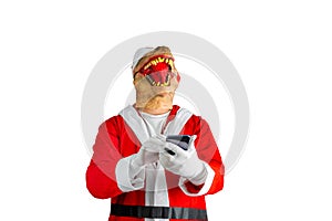 Dressed as Santa Claus writing a message with a cell phone