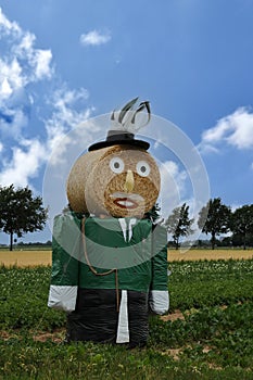 Giant straw doll  dressed as the officer of the guard