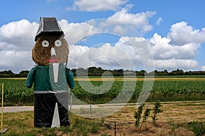 Giant straw doll  dressed as the officer of the guard