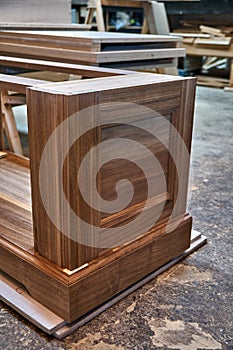 Dresser elements in a workshop. Solid wood chest of drawers. Furniture manufacture