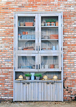 Dresser with its shelves filled with flower pot