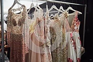 Dresses on hangers backstage at the New York Life fashion show during MBFW Fall 2015