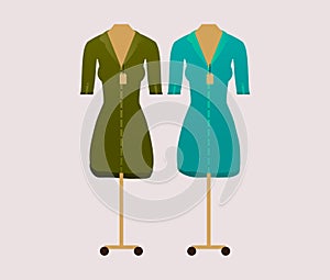 Dresses on a mannequin on a gray background. Flat. Vector