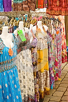 Dresses on market stall. photo